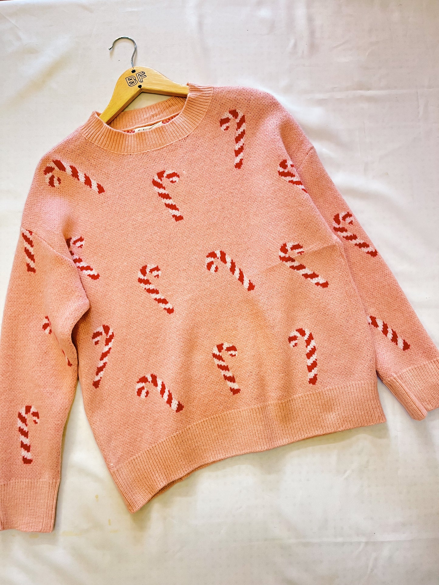 Suéter navideño caramelos rosa